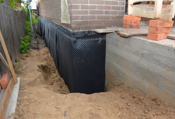 Happy homeowners after waterproofing job in Wartburg
